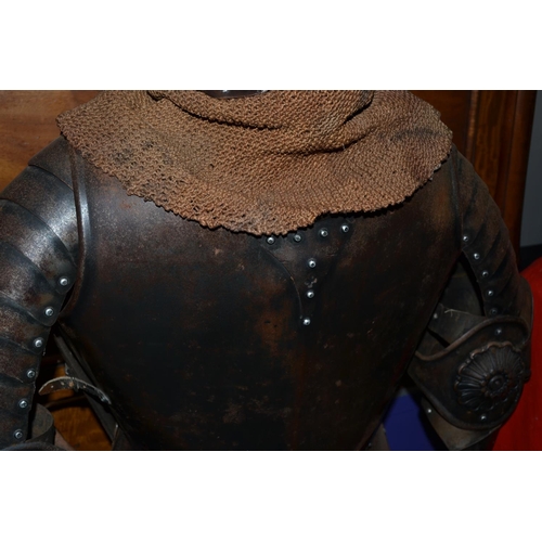 130 - A lifesize decorative 17th century style suit of armour on wooden stand - approx 68