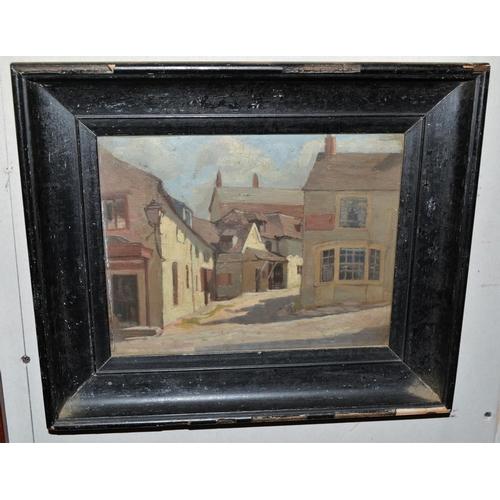 557 - An unusual small black framed oil on board of a street scene c.1930 - unsigned but pencil inscriptio... 