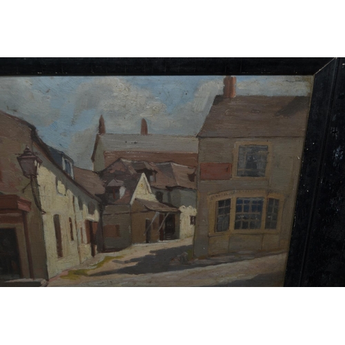 557 - An unusual small black framed oil on board of a street scene c.1930 - unsigned but pencil inscriptio... 