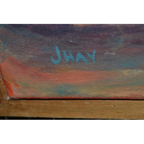 559 - J Hay (20thC) - An oil on canvas of a seated Arabic gentleman with Arabic script signed J Hay lower ... 