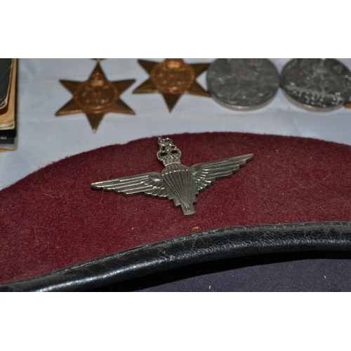 119 - A set of 5 WW2 medals, a maroon Paratrooper beret, 2 badges (KC & QC) and 2 books