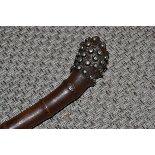 458 - A 19th century bamboo walking stick with Piquetwork decoration.