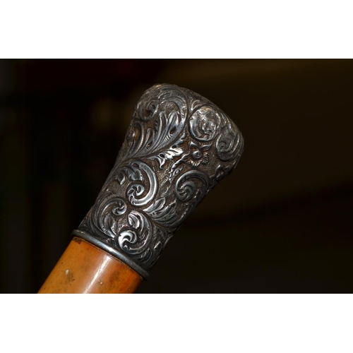 459 - A good quality white metal topped Malacca walking cane, the top engraved with John Macintyre - Lizva... 