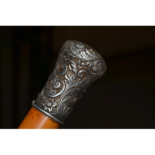 459 - A good quality white metal topped Malacca walking cane, the top engraved with John Macintyre - Lizva... 