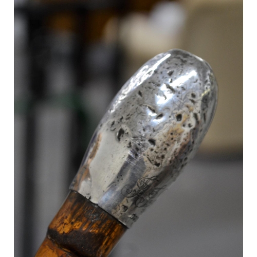 463 - An unusual silver topped walking cane with silver pommel engraved - J Jackson - London 1896 believed