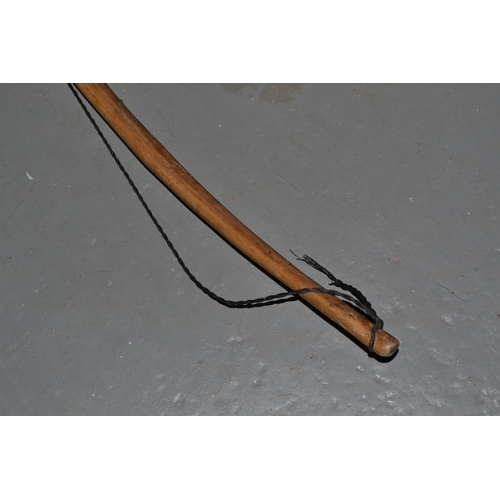 129 - A vintage wooden longbow