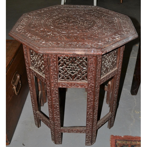 65 - A highly carved folding Indian hardwood table c.1900