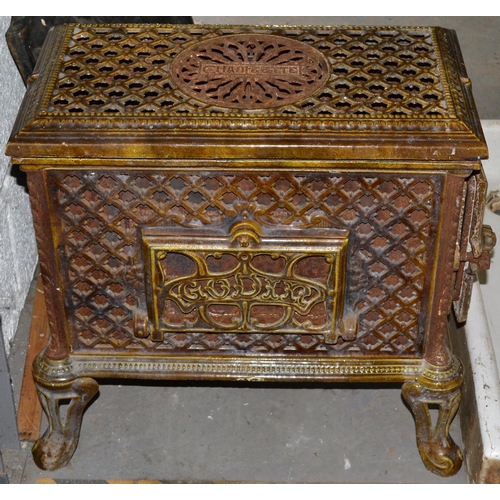 76 - An early 20th century cast iron and enamel wood burning stove by Godin