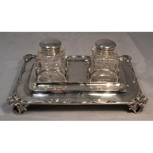 470 - A solid silver desk stand with silver and glass inkwells - the stand London 1901 by W & C Sissons an... 