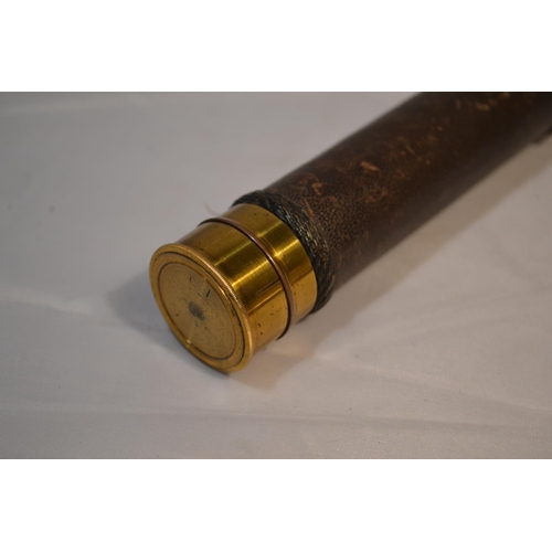 471 - A small antique brass and leather 3 draw telescope