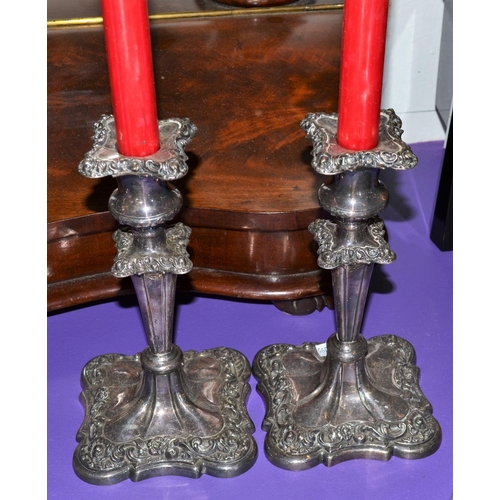 476 - A pair of good quality antique silver plated candlesticks and candles