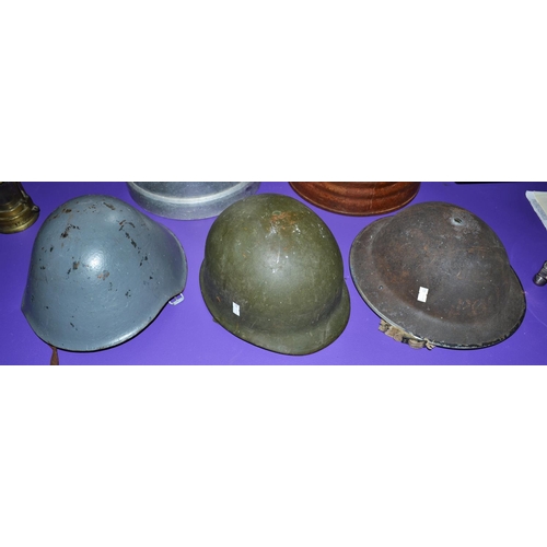 124 - 3 vintage military helmets to include a WW2 period police Brodie helmet