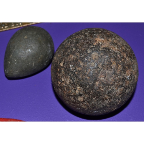 134 - 2 antique cast iron cannon balls