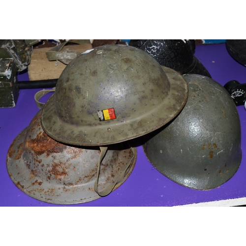 144 - 3 assorted military helmets to include a Belgian Brodie