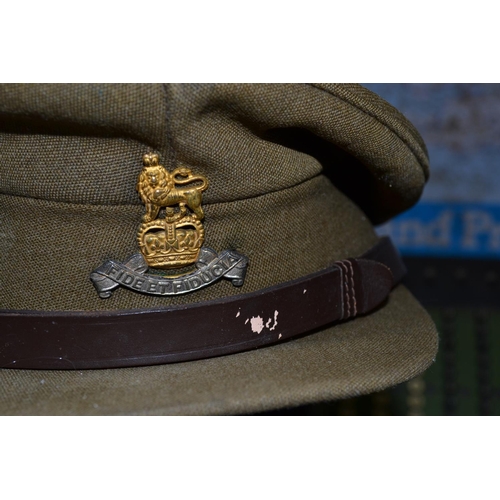 149 - A British army cap and 3 German military caps