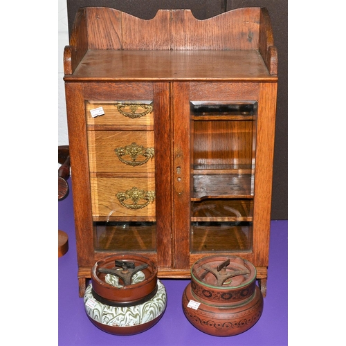 170 - A vintage Oak smokers cabinet and 2 pottery tobacco jars