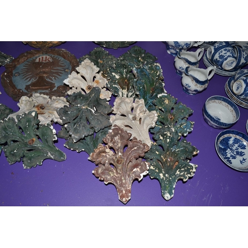 199 - A collection of 19th century or earlier religious plaster plaques and foliage