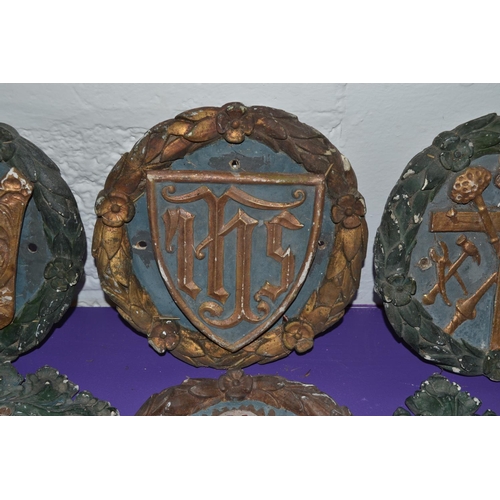 199 - A collection of 19th century or earlier religious plaster plaques and foliage