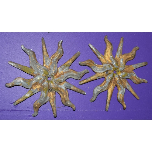 201 - A pair of 19th century or earlier cast lead painted sunburst symbols -