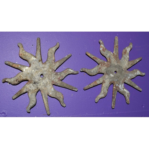 201 - A pair of 19th century or earlier cast lead painted sunburst symbols -