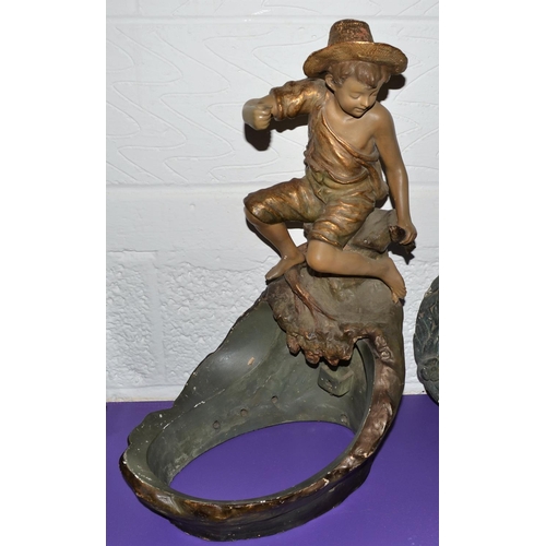 203 - A Rare Goldscheider figural fishbowl stand mounted with a boy fishing c.1900