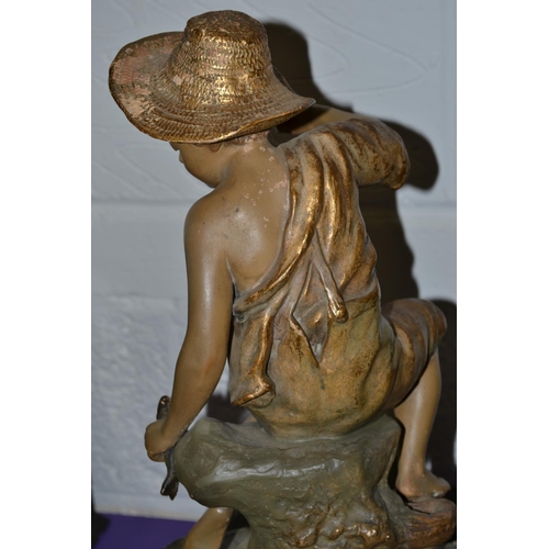 203 - A Rare Goldscheider figural fishbowl stand mounted with a boy fishing c.1900