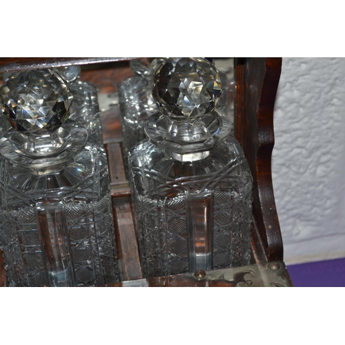 204 - A late 19th century 3 bottle games Tantalus with secret drawer