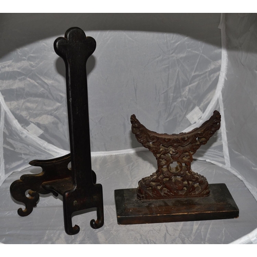 208 - A Chinese hardwood carved mirror stand and a plate stand both c.1900