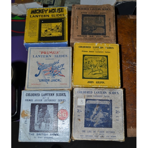 215 - A collection of glass lantern slides to include some Military and Mickey Mouse approx 18 sets