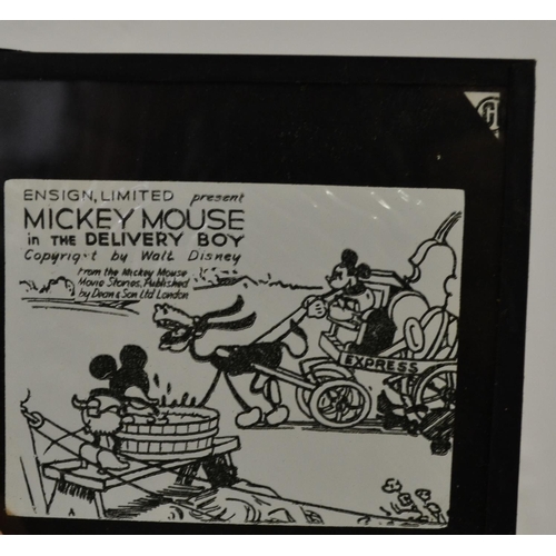 215 - A collection of glass lantern slides to include some Military and Mickey Mouse approx 18 sets