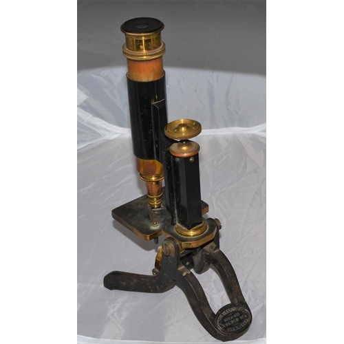 219 - An antique Phillip Harris of Birmingham microscope in case