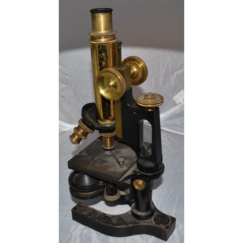 221 - An antique Bausch & Lomb Microscope in case