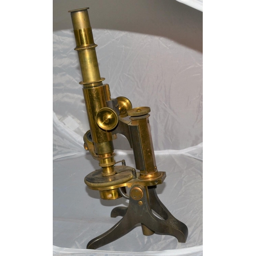 222 - An antique brass microscope with signature