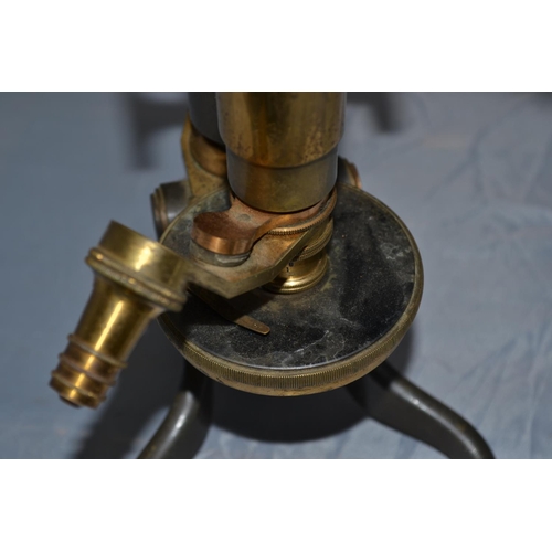 222 - An antique brass microscope with signature