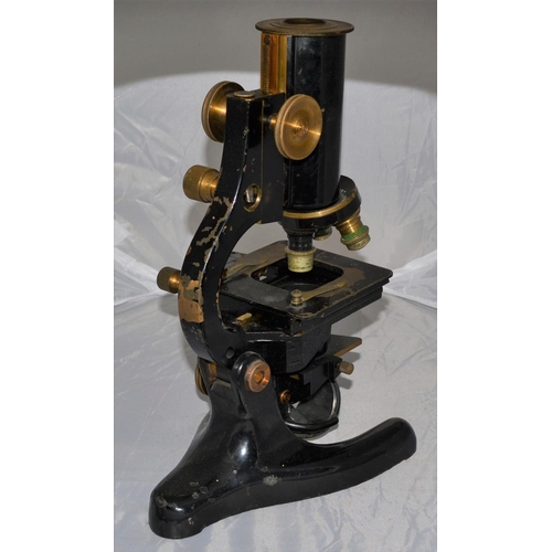 223 - An antique microscope with Beck lenses