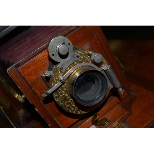 229 - A late 19th century bellows camera with lenses - patent 22 May 1894