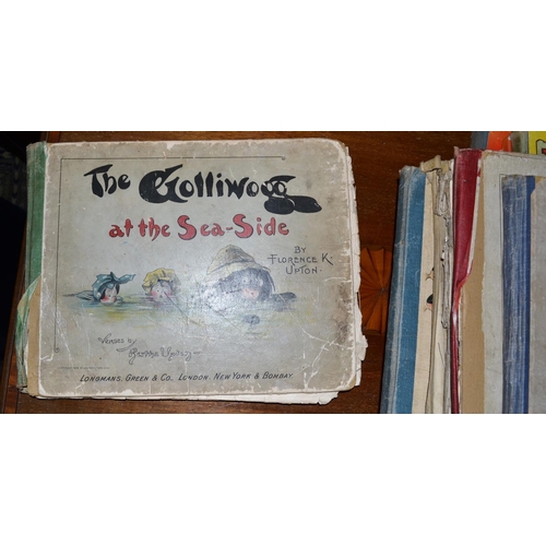 261 - A quantity of vintage children's books to include Gollywogg books