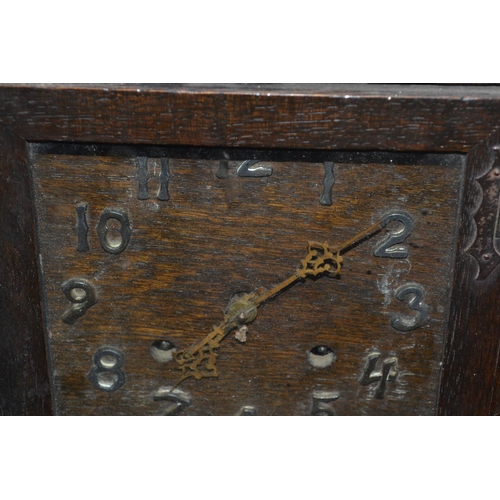 249 - An unusual Arts & Crafts period and style mantel clock in the style of Voysey