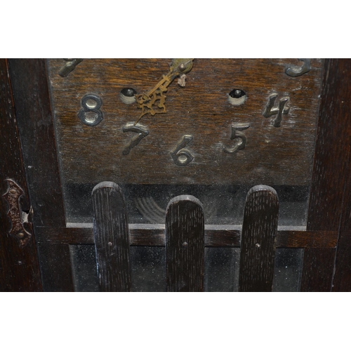 249 - An unusual Arts & Crafts period and style mantel clock in the style of Voysey