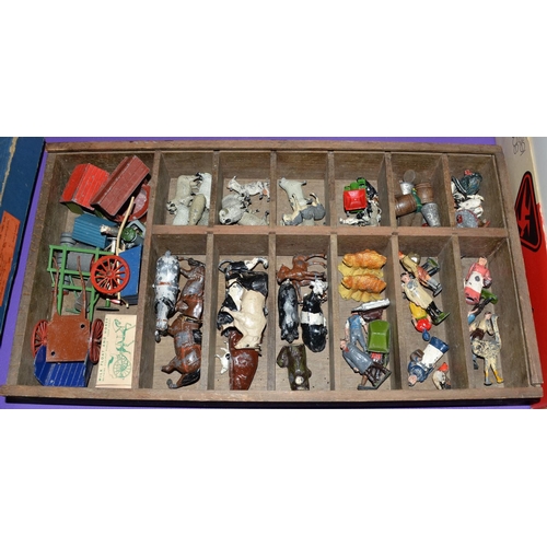 272 - A box of cast lead farm animals and farm machinery - some Britains