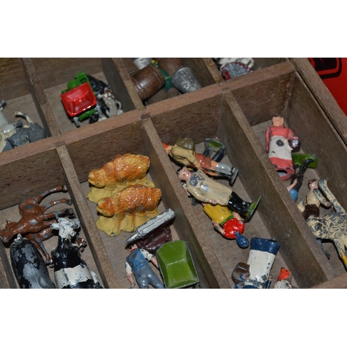 272 - A box of cast lead farm animals and farm machinery - some Britains