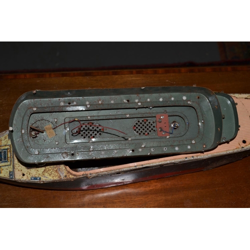 277 - A vintage tin plate boat or cruise ship originally housing a motor