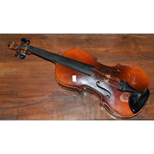 285 - An antique violin with a 2 piece back bearing a Stradivarius label - case and bow