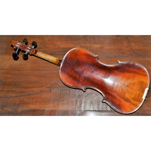 285 - An antique violin with a 2 piece back bearing a Stradivarius label - case and bow