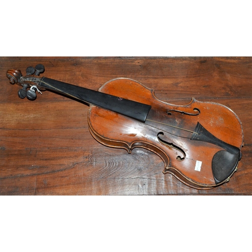 289 - An antique violin with a 2 piece back bearing a Stradivarius label - case and bow