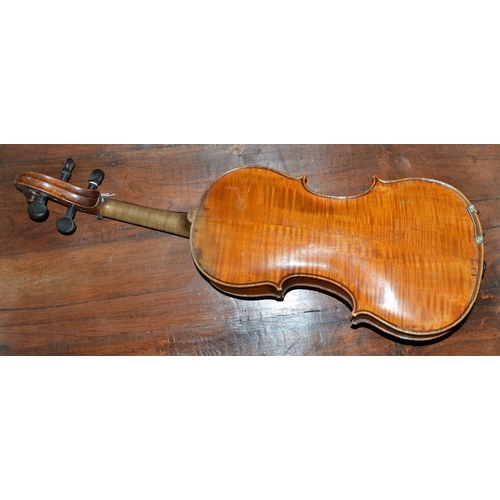 289 - An antique violin with a 2 piece back bearing a Stradivarius label - case and bow