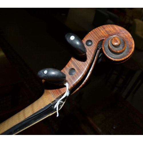 289 - An antique violin with a 2 piece back bearing a Stradivarius label - case and bow