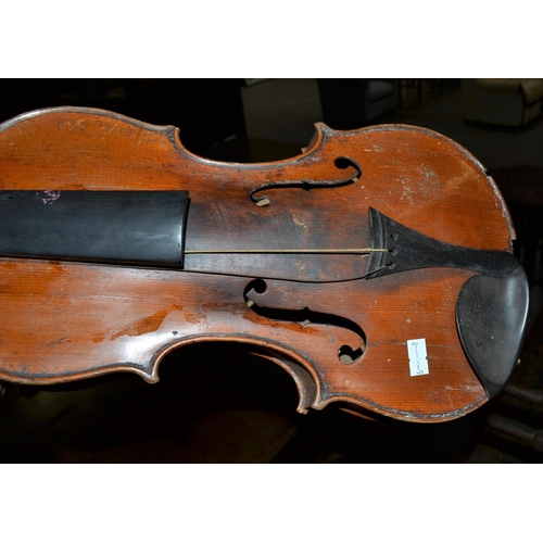 289 - An antique violin with a 2 piece back bearing a Stradivarius label - case and bow