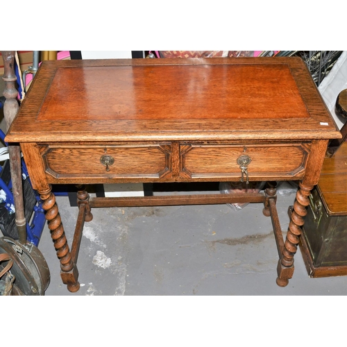 77 - 1930s oak and leather topped desk on barley twist supports