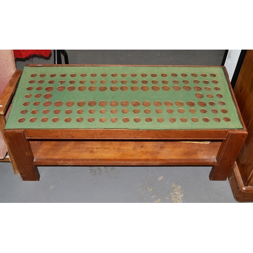 64 - Glass topped coffee table previously set with coins